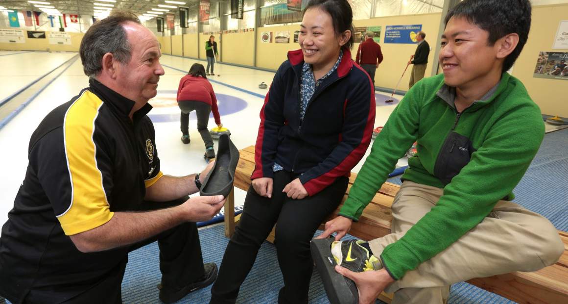 Curling in Naseby fitting safe shoe covers for on the ice