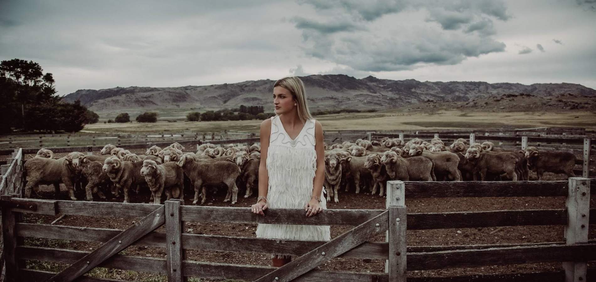 woolon Event Fashion Garments white dress in sheep yards Photographer Lisa Davidson