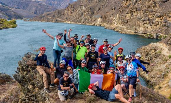 Conference delegates celebrate St Patricks Day in style whilst cycling Lake Dunstan Trail Central Otago